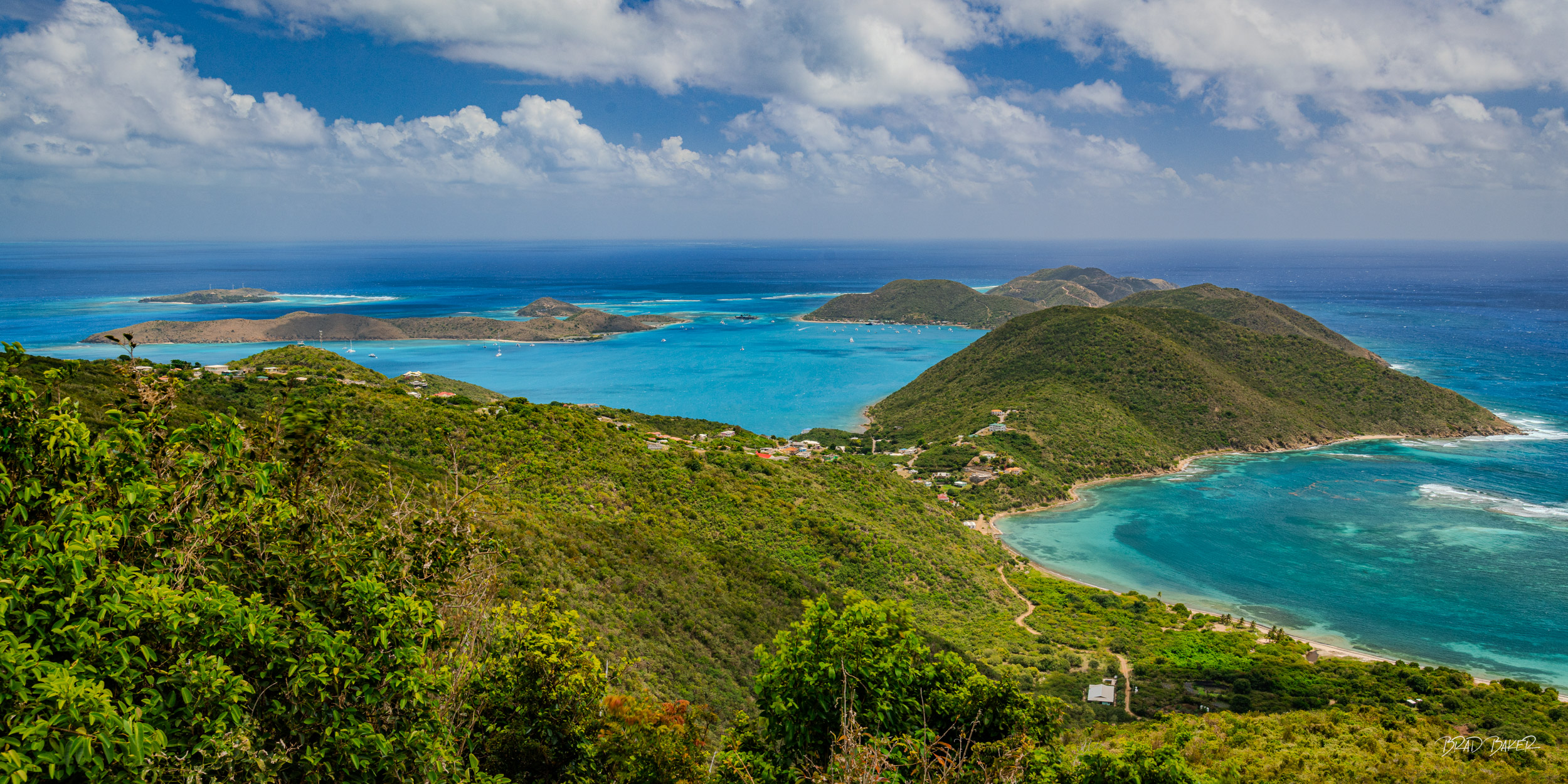 NORTH SOUND TO NECKER Sweeping panoramic aerial view of Virgin Gorda's North Sound with turquoise bays, green hills, and scattered islands