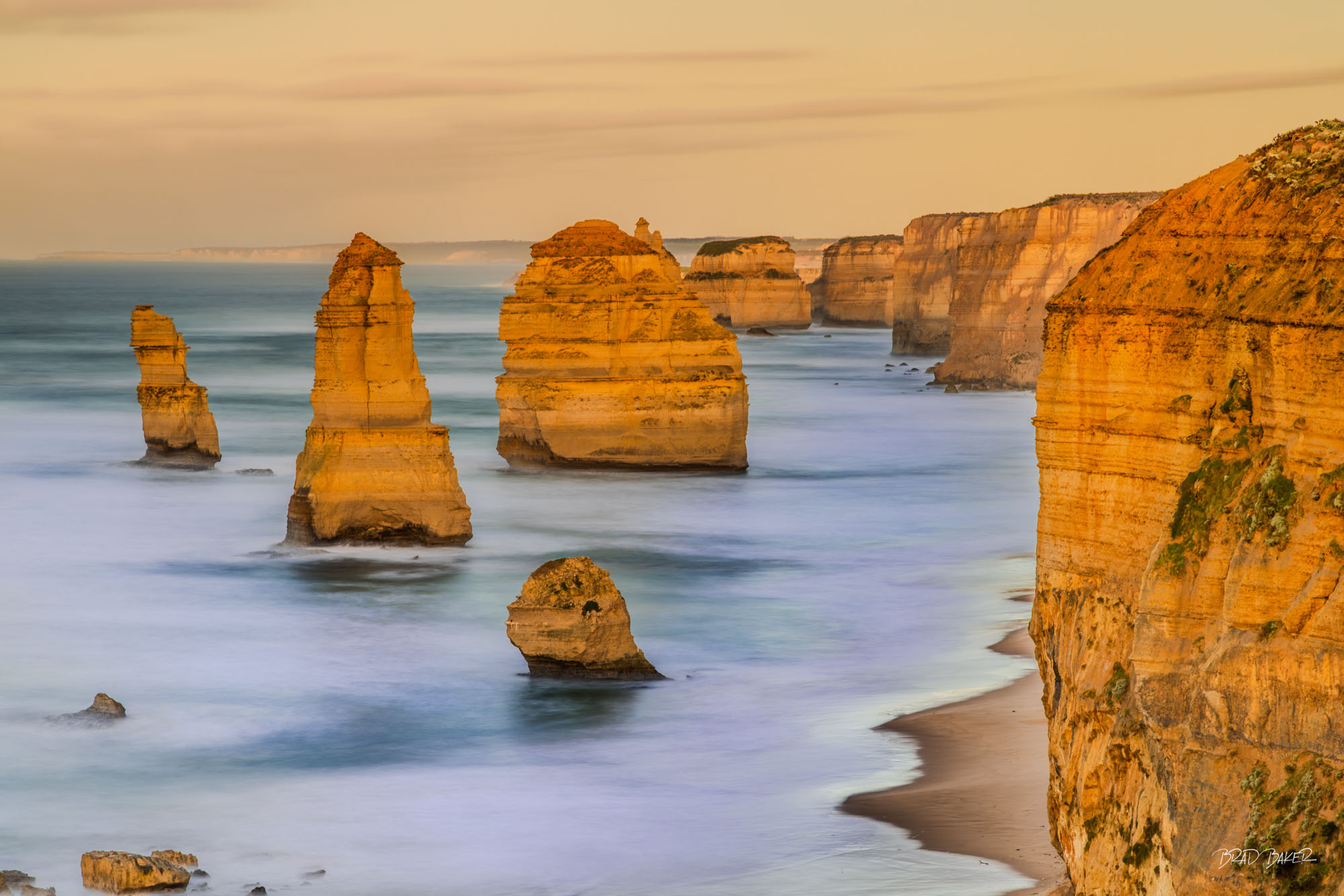 NUMEROUS APOSTLES Golden Twelve Apostles sea stacks and coastal cliffs along Victoria’s Great Ocean Road, Australia